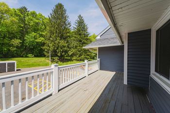 a deck with a view of a yard and a house at Woodbury, Connecticut, 06798